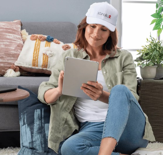 Image of a woman comfortably using laser cap in everyday life